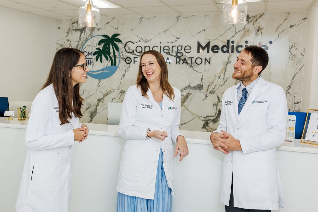 The physicians of Concierge Medicine of Boca Raton in the practice reception area